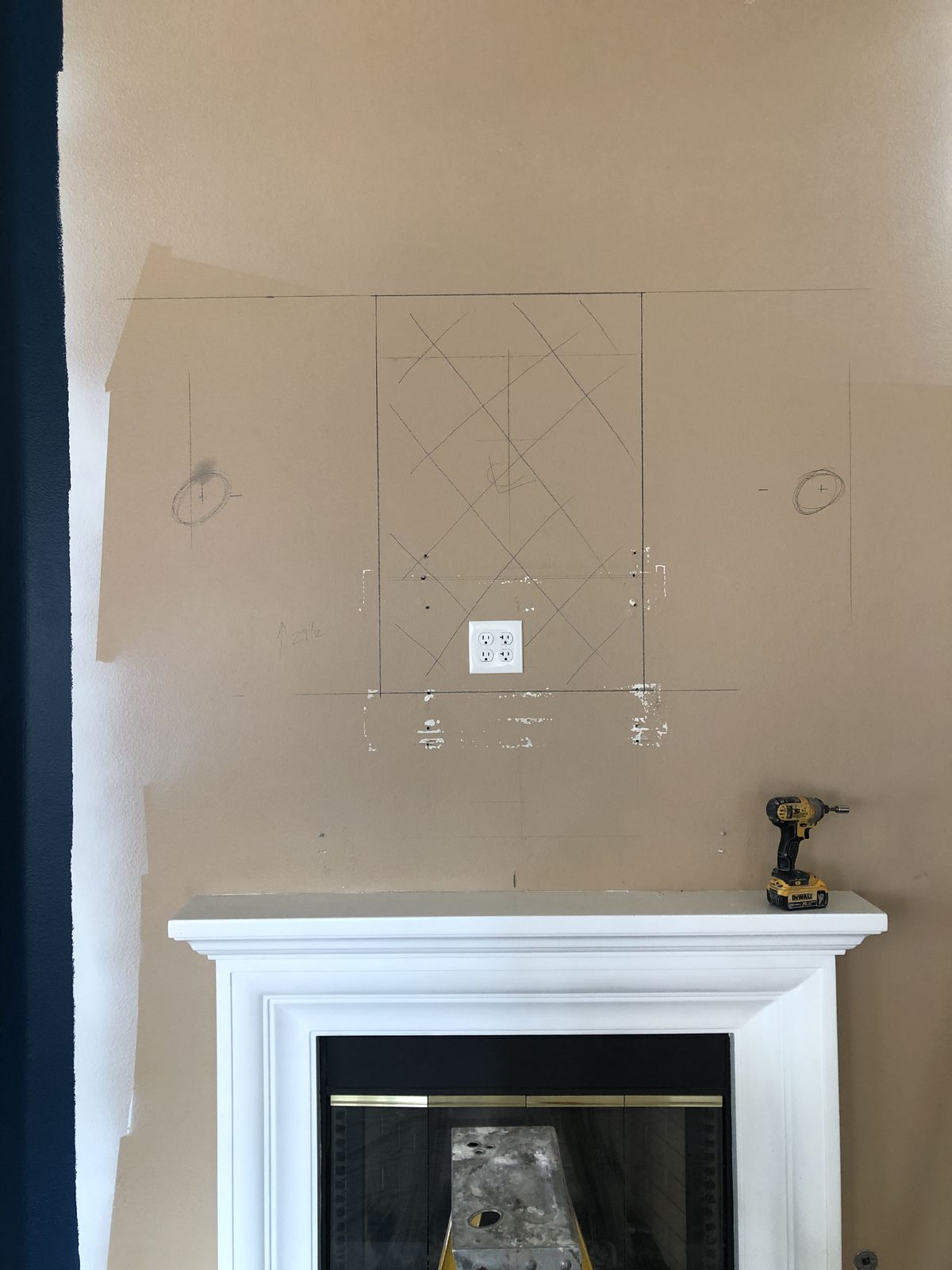 Fireplace wall before, marked up for the stone layout