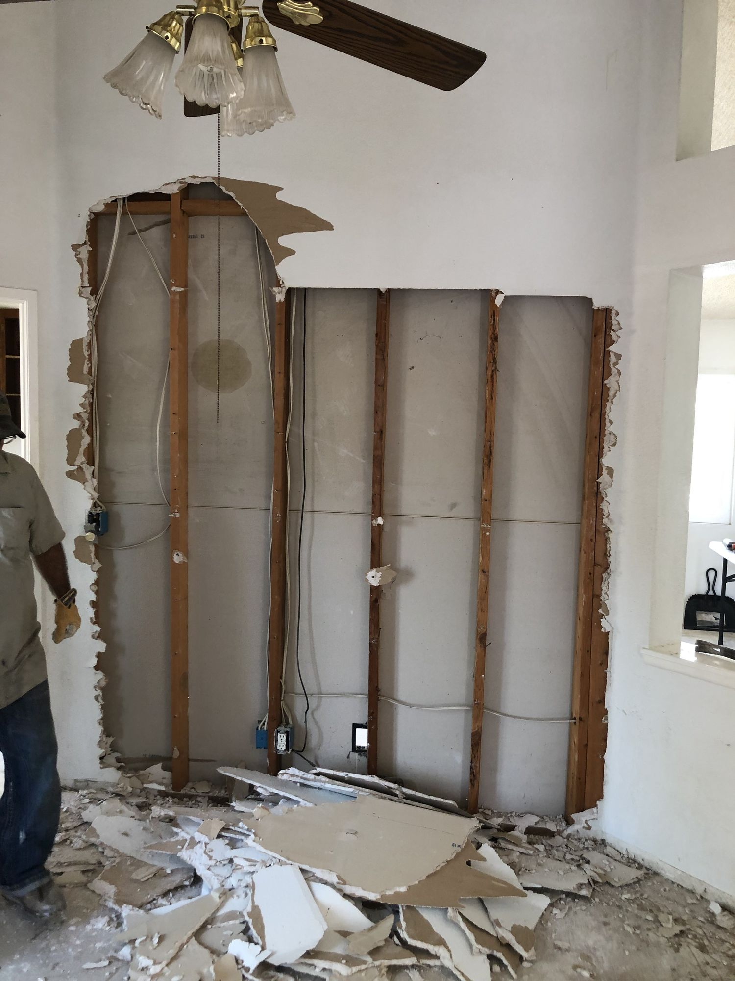 Before: wall torn down to the studs during demolition